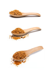 Brown sugar in a wooden spoon isolated on white background.