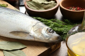Salted herring and spices on table, closeup
