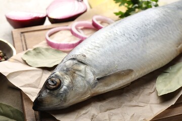 Salted herring and spices on table, closeup