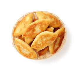 Delicious fried pyrizhky (stuffed pies) isolated on white, top view