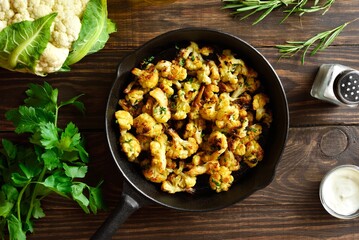 Roasted cauliflower in cast iron skillet, top view