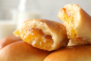 Tasty baked patties against blurred background, closeup