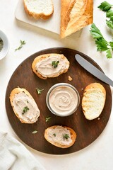 Chicken liver pate on wooden cutting board