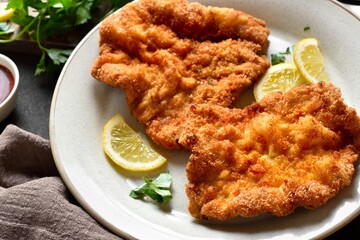 Schnitzel with lemon and leaves of parsley