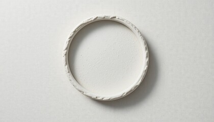 Crafting a minimalist white circular frame home studio decorative art clean environment top-down view modern aesthetics