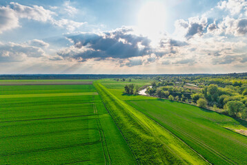 Aerial landscape of the green fields in northern Poland at spring time