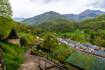 Naklejka premium Village of Castillon-en-Couserans in the heart of a green and hilly landscape characteristic of the Couserans region in spring