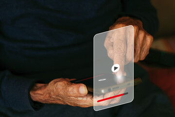 Close-up of an older man's hands watching a streaming video on his mobile phone
