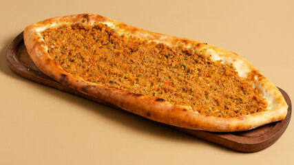 Turkish pide on wooden tray top view isolated