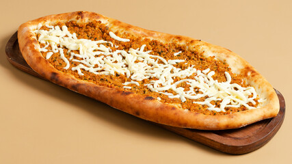 Turkish pide on wooden tray top view isolated