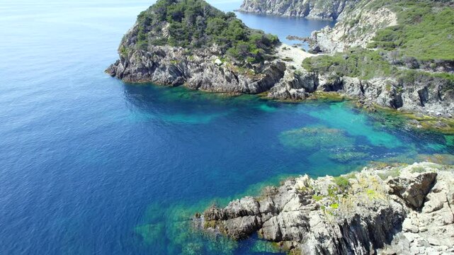 Aerial view of the Island of Porquerolles -  Paradise Beaches and the Sentier du Litoral Hiking cliffs with Sailboat Anchorage Bay	
