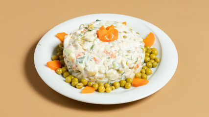 Olivier salad plate isolated on yellow