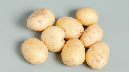 Potatoes isolated on grey background