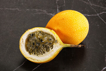 Yellow granadilla with cut half