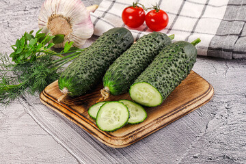 Raw green cucumbers with slices