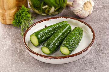 Homemade lighty salted cucumbers with herbs
