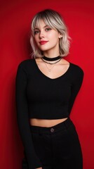 Stylish Young Woman Posing Against Vibrant Red Background