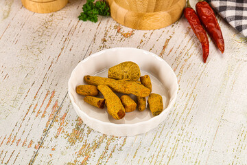 Raw dry Tumeric roots heap