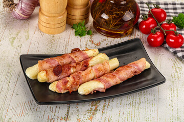 Hot mozzarella sticks with bacon