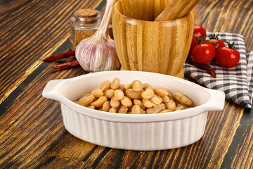Baked white canned beans in the bowl