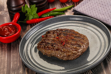 Grilled beef burger cutlet with sauce