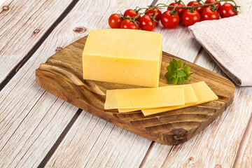 Yellow cheese piece with slices