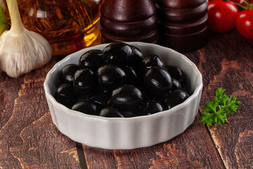 Mediterranean marinated Black olives in the bowl