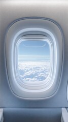 An airplane window seat, showing a vast sky filled with fluffy clouds.