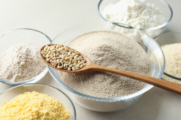 Different types of flour on white background, closeup