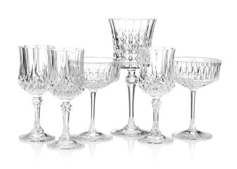 Different empty clean glasses isolated on white