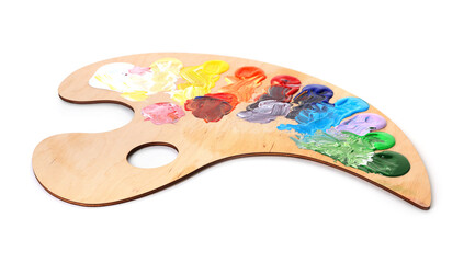 Wooden palette with paints isolated on white