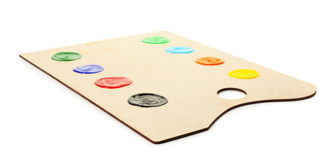 Wooden palette with paints isolated on white