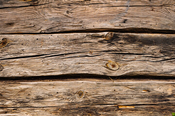 Obraz premium Old grunge dark textured wooden background showing cracks and knots