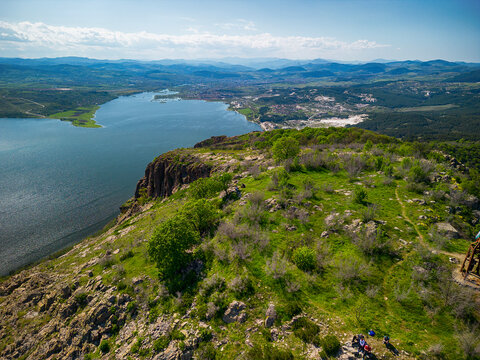 Drone view of the ancient Monyak fortress located on a hill near Kardzhali, Bulgaria. Panoramic view of the ancient Monyak fortress located on a hill on the shore of the dam Studen Kladenets near Kard