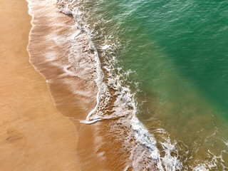 Clean sandy beach and ocean surf along the Sri Lanka coast, perfect tropical travel and background scene