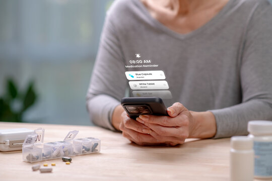 Senior Asian Woman checking medication reminder on phone, in concept of Augmented reality, Application Interface design, UX UI design, and Health care