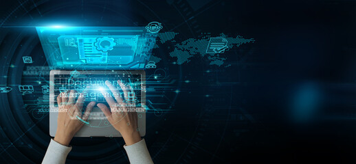 A man using a laptop with Document Management on the keyboard, analyzing and developing various information about file organization, and compliance tracking for efficient information handling.
