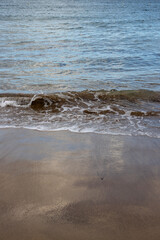 Sand beach and a line of the tide, Gran Canaria, Spain
