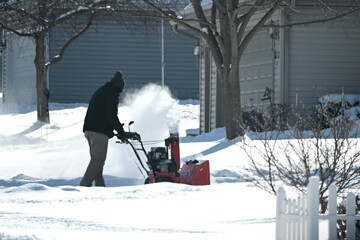 Man Using Snowblower