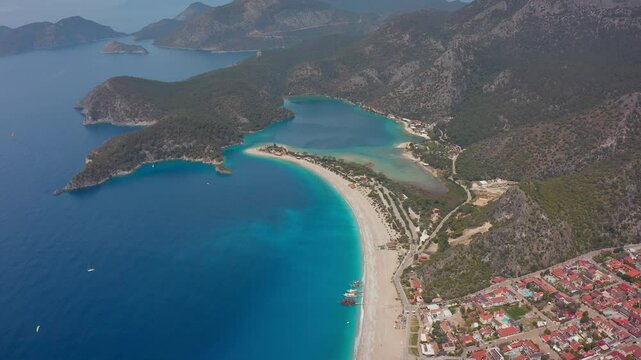 The lagoon and coastline of &Ouml;l&uuml;deniz are displayed in all their glory in drone imagery. The bays of the Aegean and the mountain formations perpendicular to the sea are seen in the background.