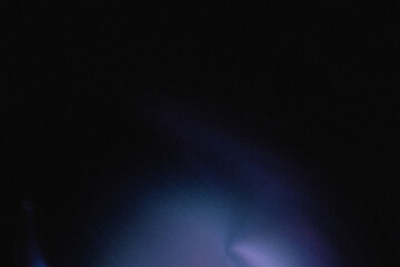 Abstract blue and white light explosion effect with dark background creating a mysterious atmosphere