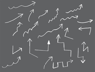 arrows on chalkboard. Hand-drawn arrows, chalk sketches, directional symbols, white on blackboard, variety of shapes, upward movement, zigzag lines, wavy curves, simple illustrations