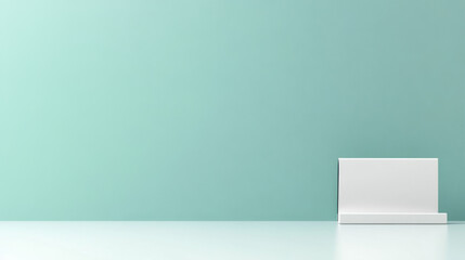 Minimalist backdrop featu a light teal wall and a small white block platform, perfect for showcasing products with a clean and contemporary aesthetic look.