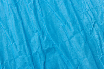 Obraz premium Abstract wrinkled blue crumpled paper texture background