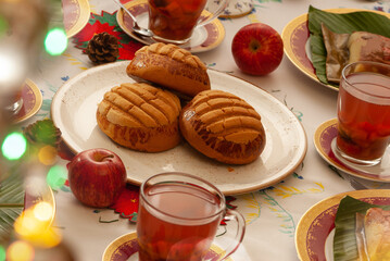 Tilted Perspective: Three Medium Mantecados on White Plate – Seasonal Spread with Tamales and Warm Ponche