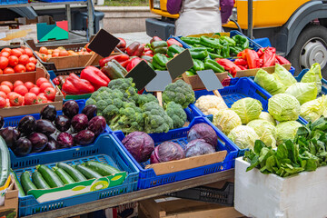 set of different vegetables at a stall in a street market