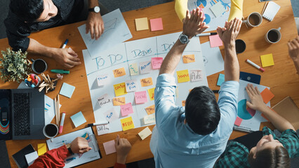Top down aerial view of smart business team making scrum task board at meeting room. Group of smart...