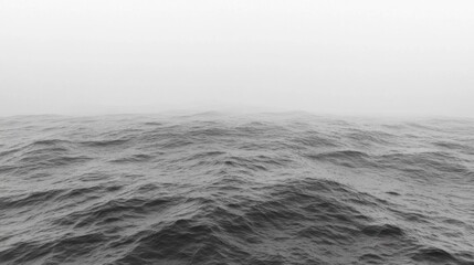 Gray foggy sea waves at horizon