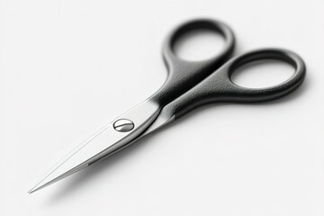 Obraz premium Sharp scissors with black handles positioned on a white surface, ideal for crafting and office tasks