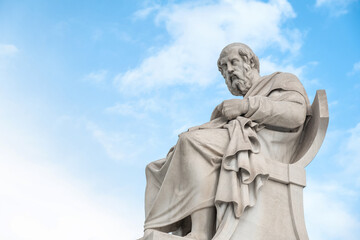 Obraz premium Statue of Plato from the Academy of Athens, Greece against blue sky. Popular Greek landmark and travel destination
